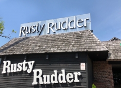 Sign for Rusty Rudder in Dewey Beach, DE